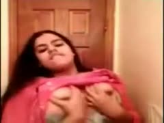 Seductive busty Indian hottie in pink sari brags of her priceless large breasts 